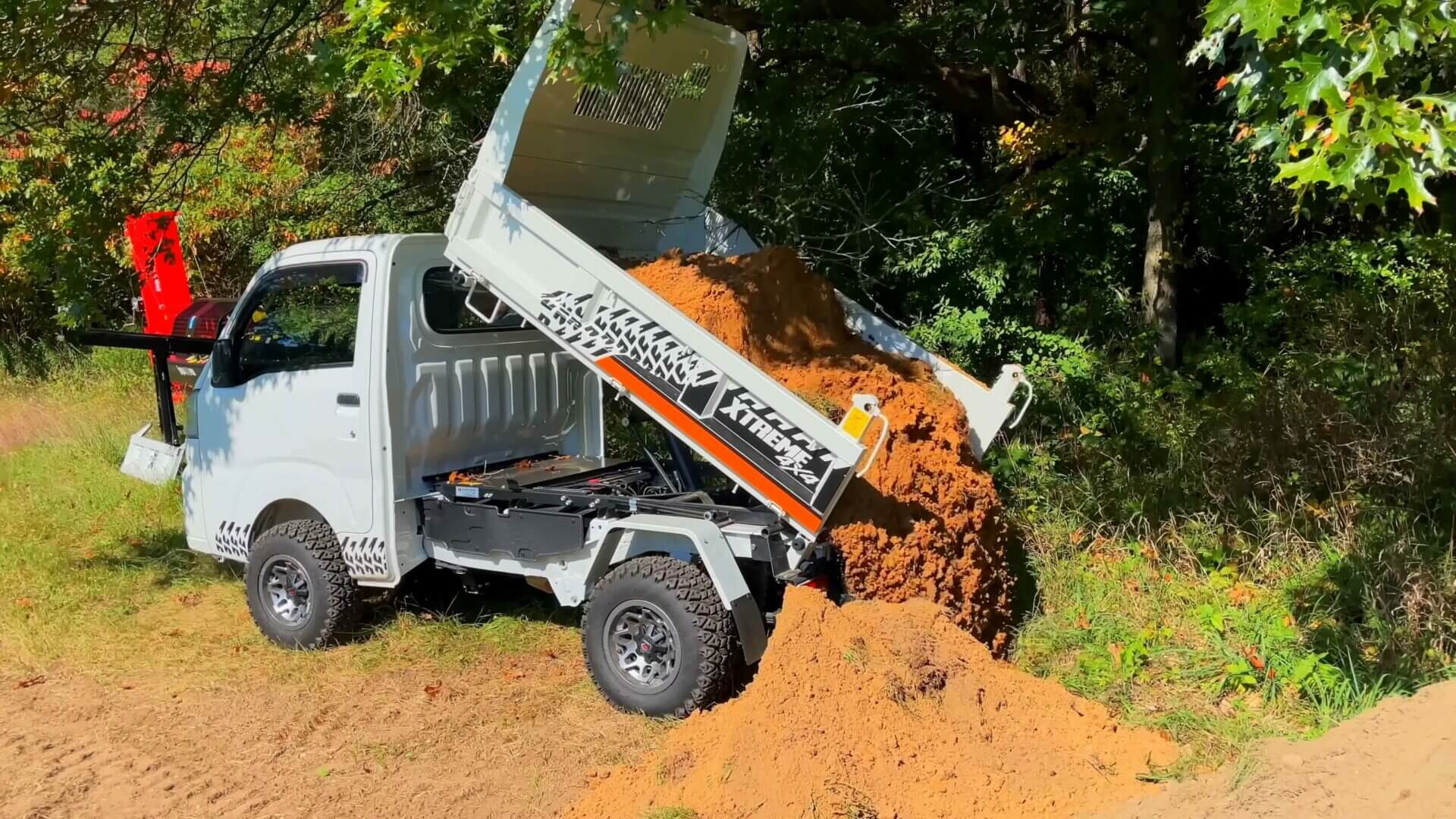 Kei truck being used for farm work in a rural setting